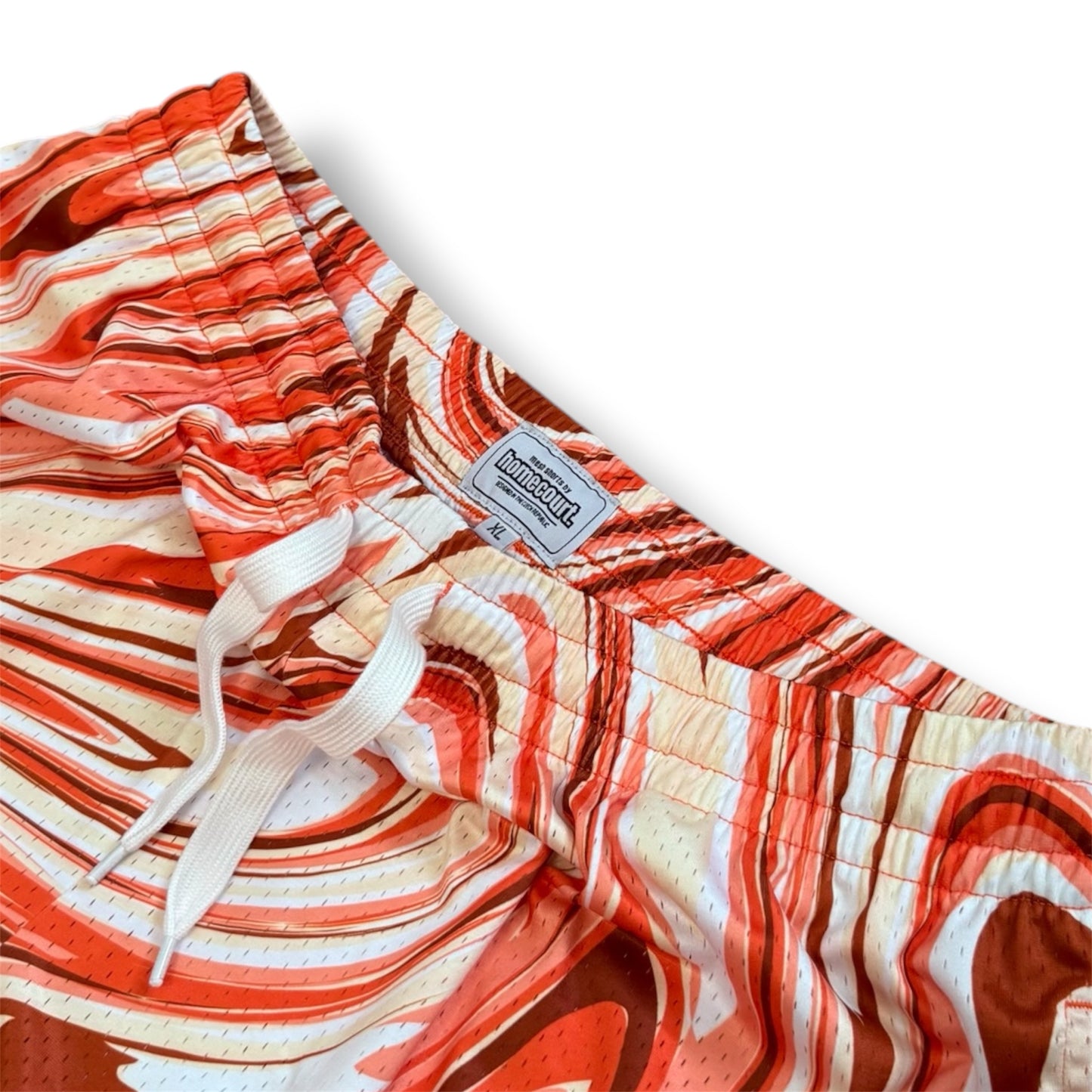 Mesh shorts: orange swirl
